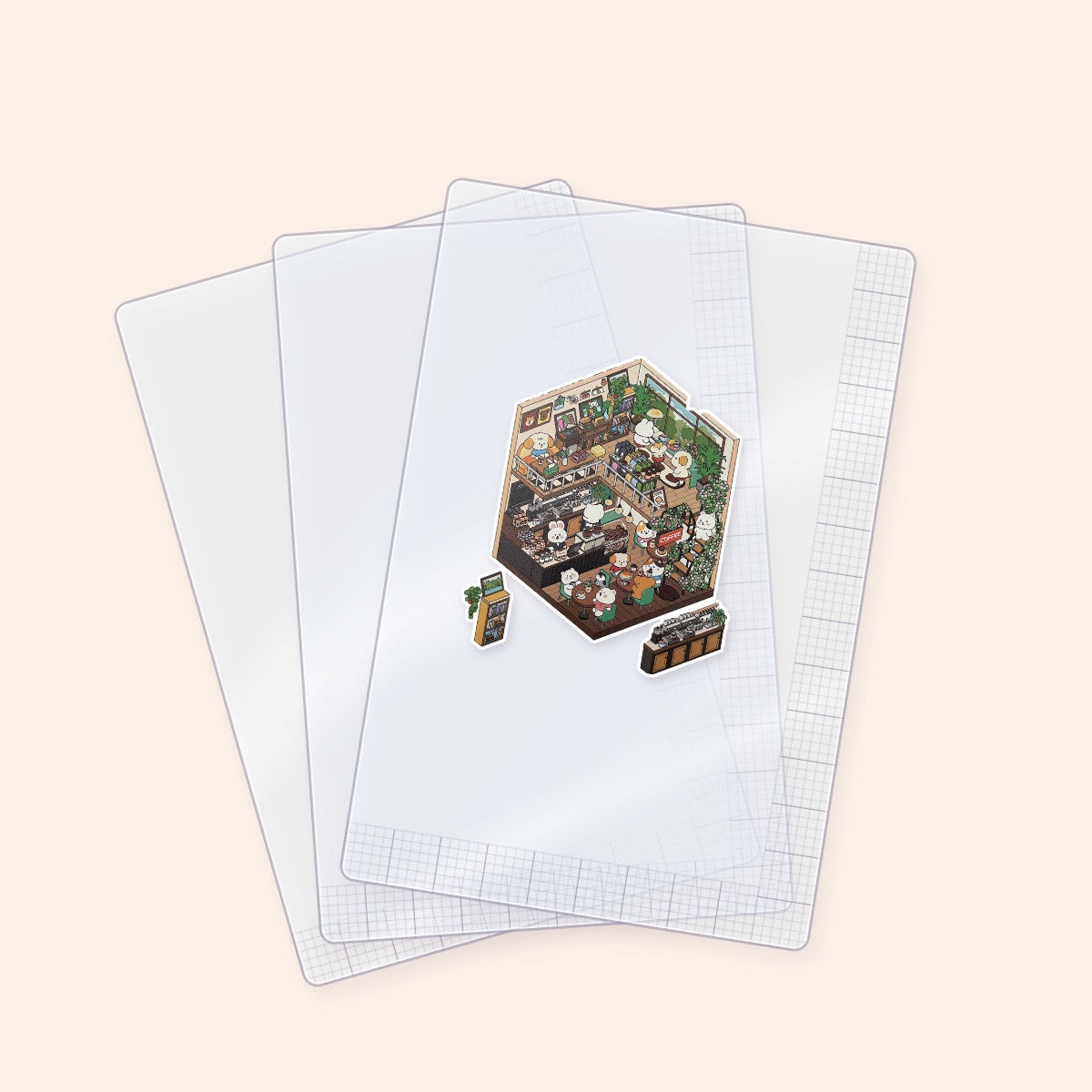 Clear A6 positioning sheets with a scene sticker arranged on top